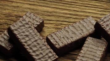 Chocolate cookies on wooden table. video