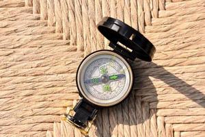 Compass on woven background photo