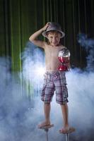 Little boy learns to juggle. Child of the circus. photo