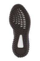 The semi-veritan sole of the shoe is black with white stripes. photo