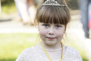 Belarus, city of Gomil, May 16, 2019. Morning in kindergarten.Close-up portrait of a little six-year-old girl. photo