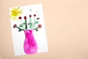 Child's drawing. Application of children's creativity. Kindergarten and craft school. The child drew a vase and flowers. photo