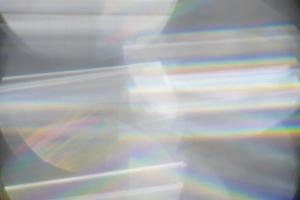 Rainbow Lens. Optical glare effect of objective lenses. Defocused blur reflection of rainbow sunbeams. photo