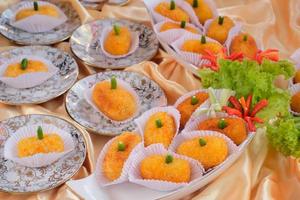 Kroket kentang is a traditional snack from Indonesia. served in wooden plate with green chilli. Delicious Indonesian Traditional Kroket Kentang with chilli photo