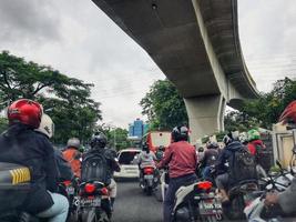 Jakarta, Indonesia in July 2022. There is a traffic jam under the Becakayu Toll Road photo