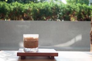 Iced coffee with micro foam in coffee shop photo