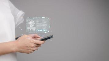 ChatGPT Chat with AI or Artificial Intelligence. Business chatting with a smart AI or artificial intelligence using an artificial intelligence chatbot developed by OpenAI. photo