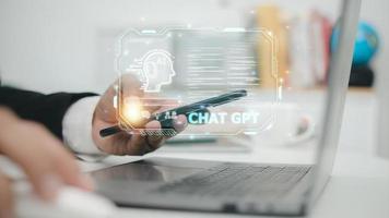 ChatGPT Chat with AI or Artificial Intelligence. Business chatting with a smart AI or artificial intelligence using an artificial intelligence chatbot developed by OpenAI. photo