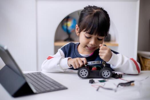 Asia students learn at home in coding robot cars and electronic board cables in STEM, STEAM, mathematics engineering science technology computer code in robotics for kids concept photo