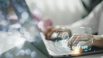 ChatGPT Chat with AI or Artificial Intelligence. Business chatting with a smart AI or artificial intelligence using an artificial intelligence chatbot developed by OpenAI. photo