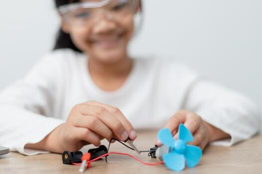 Asia students learn at home in coding robot cars and electronic board cables in STEM, STEAM, mathematics engineering science technology computer code in robotics for kids concept. photo