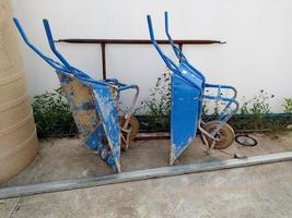 Blue metal construction cart at a construction site.