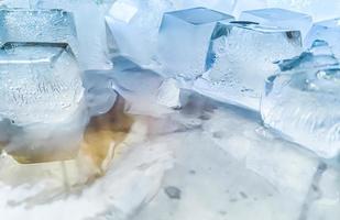 Ice cubes background, ice cube texture or background It makes me feel fresh and feel good, In the summer, ice and cold drinks will make us feel relaxed, Made for beverage or refreshment business. photo