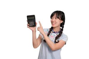 Portrait happy beautiful young asian woman in denim dress using a smartphone on white background photo