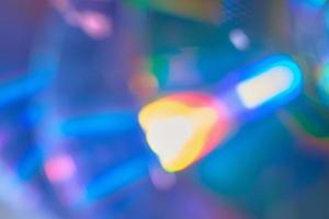 Blurred rainbow colored light flare background. photo
