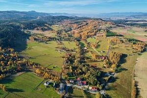 Mountain village and agricultural fields, aerial view. Nature landscape photo