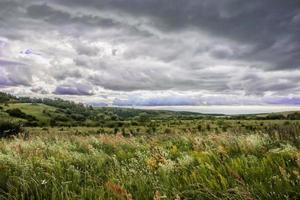 black clouds before storm on the field photo