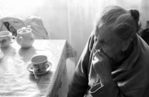 Elderly lonely woman photo