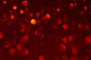 Abstract circular bokeh background of red color. Christmas and New Year concept. photo