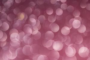 Abstract pink bokeh lights background. Christmas and New Year concept. photo