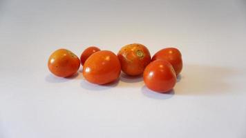 fresh tomatoes on white background. photo
