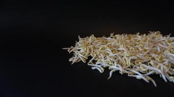 Fresh mung bean sprouts on black background. photo