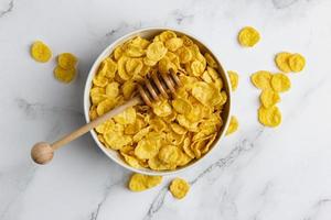 Corn flakes in white bowl. photo