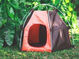 empty orange pet camping tent in the garden. photo