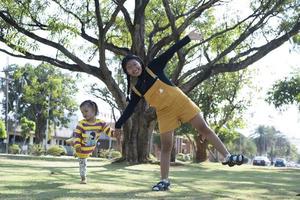 Asian family having fun in the garden Mother and daughter having fun together. photo