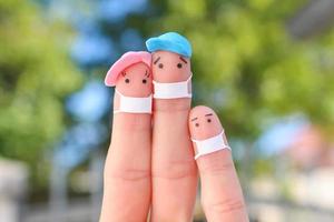 Fingers art of family with face mask. photo