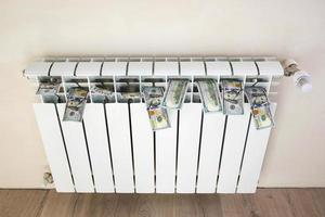 Radiator and money. The concept of payment for heating. photo