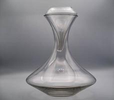 glass decanter on a white background, useful for decanting and oxygenating wine, in this case excellent Italian wine photo