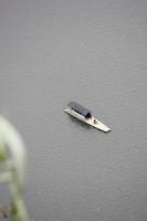 photo of a boat in the middle of a lake during the day