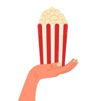 Illustration of popcorn box in hand isolated on white background. Vector concepts for graphic and web design.