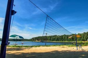 beach volleyball net against the blue sky on the beach photo