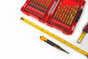 set of drill case, pencil and Measuring Construction roulette, construction tools on white background photo