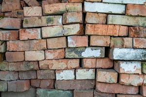 Beautiful texture old brick from big wall block, natural structure close up photo