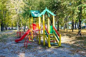 Photography on theme empty playground with metal slide for kids photo