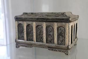 Makhachkala, Dagestan.Russia.September 20, 2022.The Dagestan aul museum.Interior exhibition.A silver casket decorated with an engraving of ancient oriental patterns. Unfocused. photo