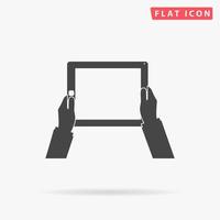 Hands holding tablet computer with blank screen. Simple flat black symbol with shadow on white background. Vector illustration pictogram