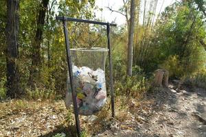 Phu Kradueng National Park, Loei province, Thailand. Garbage bags in the forest. photo