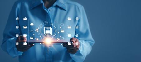 Online documentation database and process automation to efficiently manage files,  staff working with Document Management System DMS, Corporate business technology. Cognition on modern management. photo