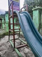 children's slide is not used and abandoned photo