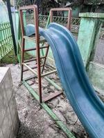 children's slide is not used and abandoned photo