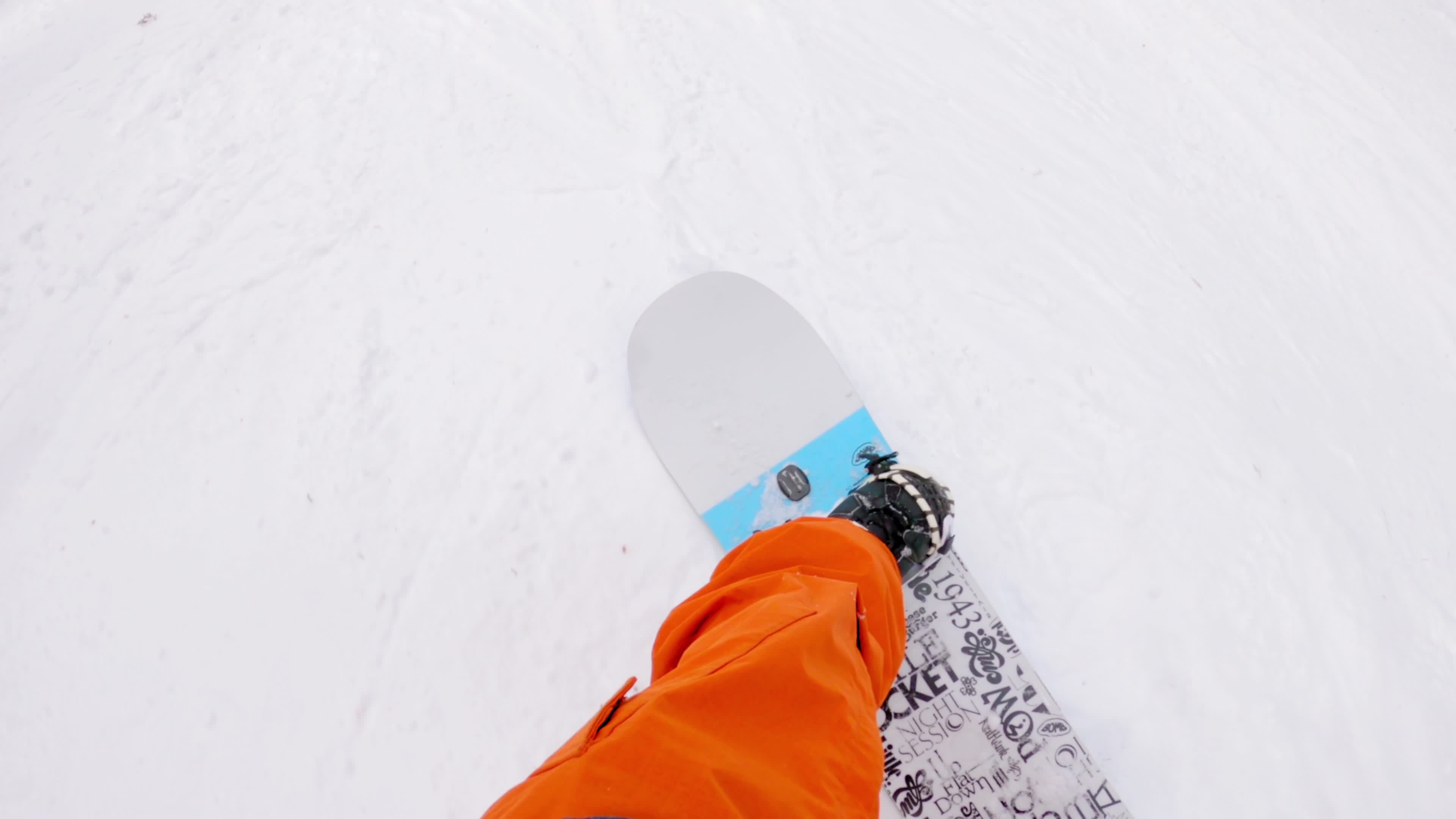 POV shot of snowboarder looking down at the front of his board 18927606