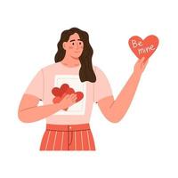 mujer muestra tarjeta en forma de corazón vector