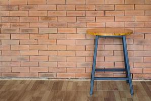 wood chair on brick wall background photo