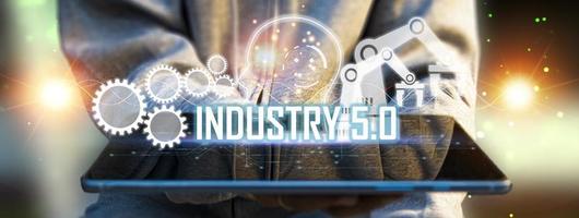 The concept of Industrial Revolution No. 5 is to improve the production process to be more efficient. By working together between humans, intelligent systems AI and robots photo