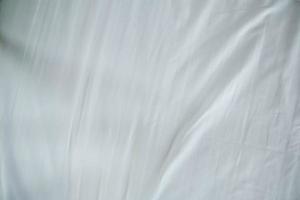 white bed linen gradient texture blurred curve style of abstract luxury fabric,Wrinkled bed linen and dark gray shadows,background photo