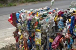 Rio, Brazil - november 26, 2022, recyclable garbage pressing into big bales photo